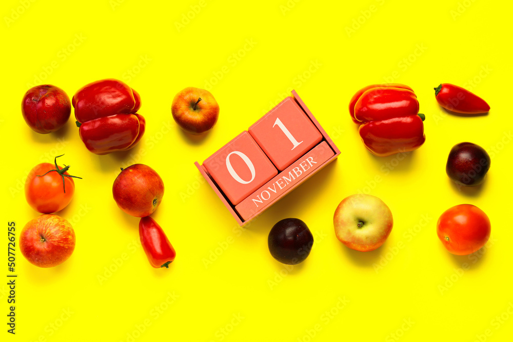 立方体日历，日期为11月1日，黄色背景为新鲜水果和蔬菜。世界素食主义者Da