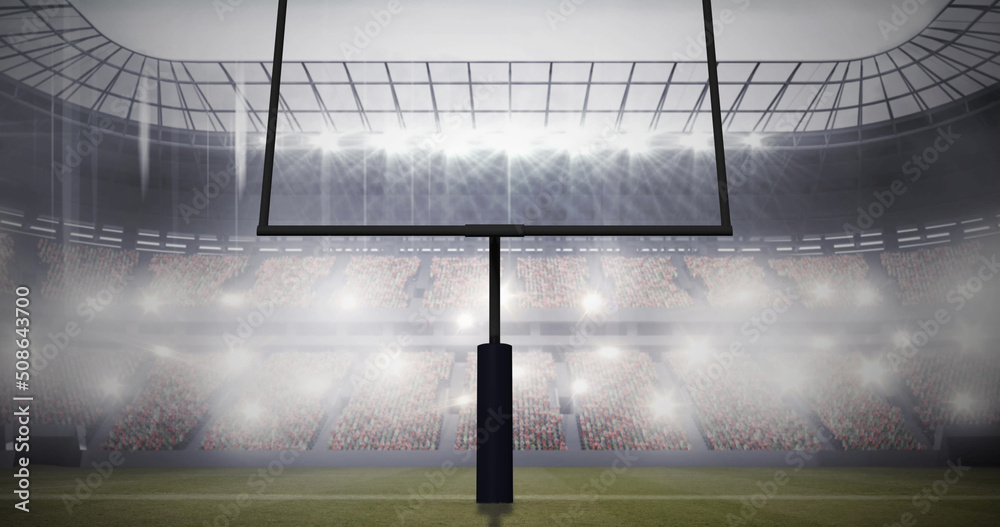 泛光灯体育场的美式足球门柱和多云的天空