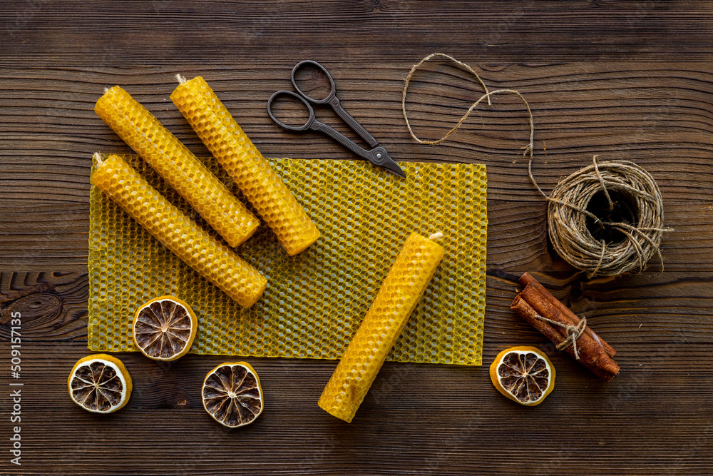Process of making honey aroma beeswax candles with honeycombs, top view