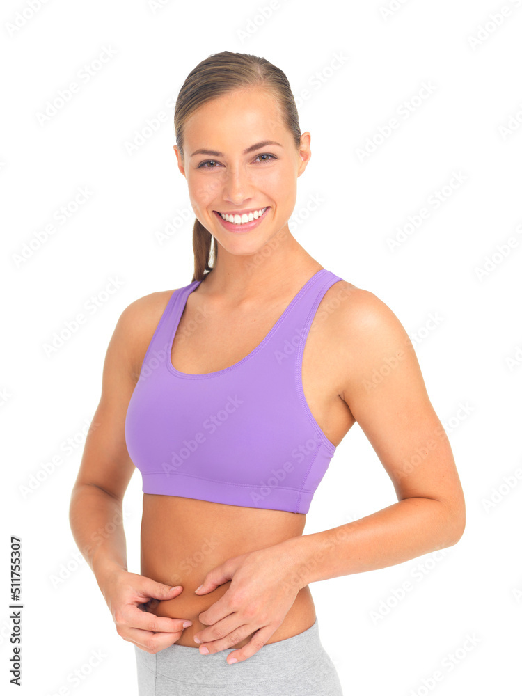 Shes positive about her healthy lifestyle. Studio portrait of a sporty young woman isolated on white