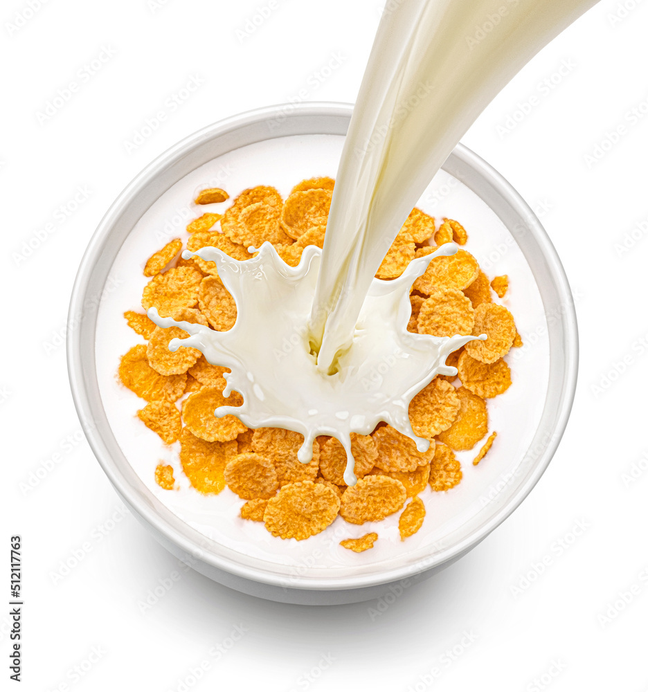 Corn flakes with pouring milk isolated on white background, top view