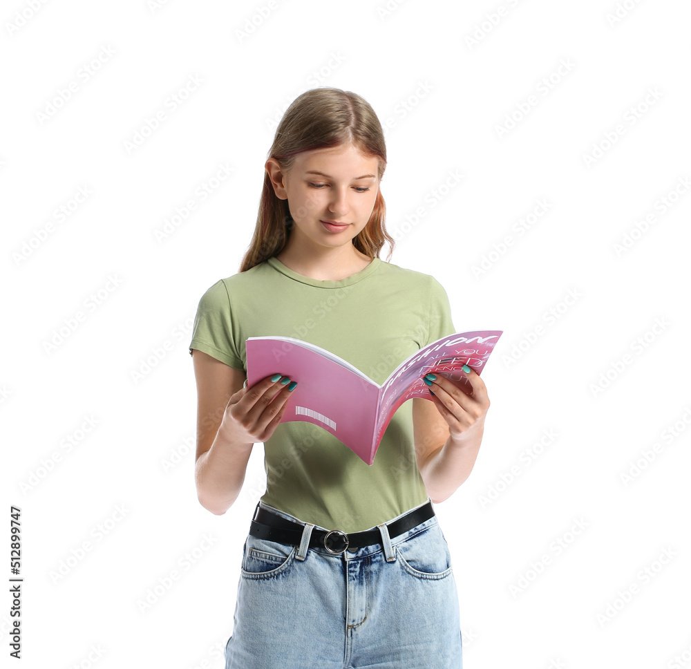 Pretty teenage girl reading magazine on white background