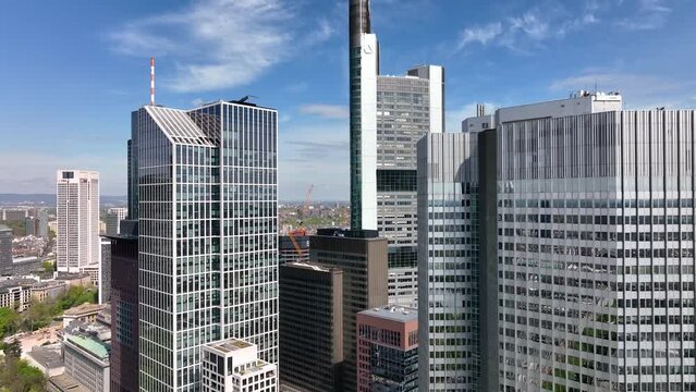 Dolly Flight through Frankfurt am Main, Germany Skyline New Skyscrapers Urban Canyon. Aerial Pedestal in Establishing Drone Shot
