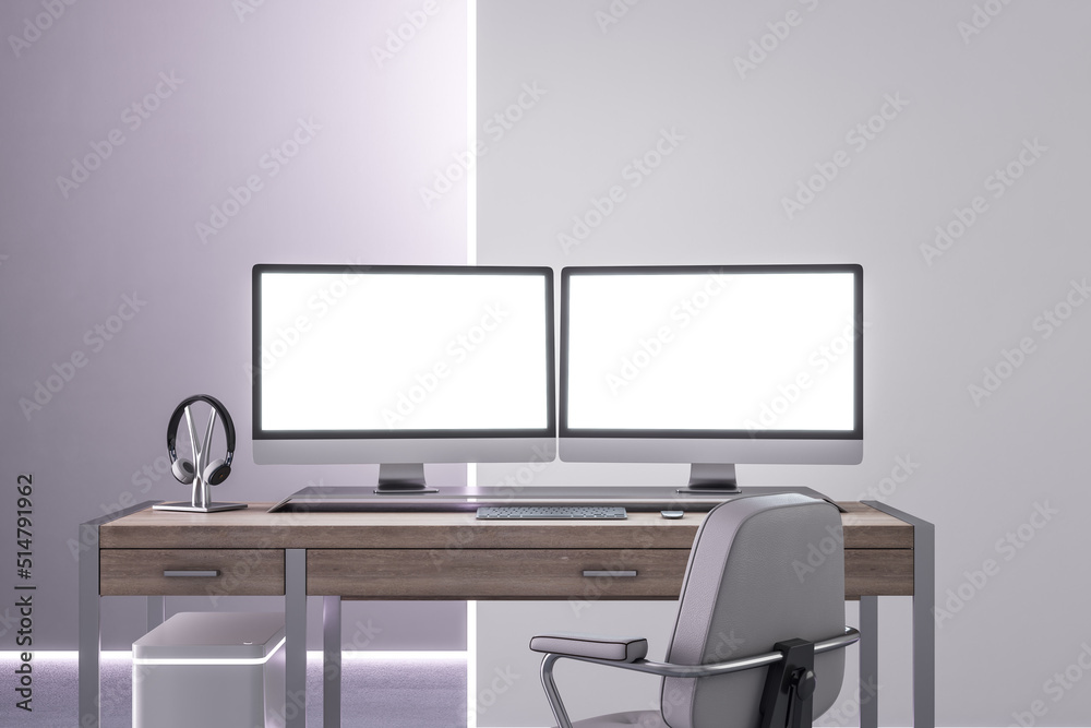 Front view on two blank white illuminated monitor screens with place for your logo or text on light 