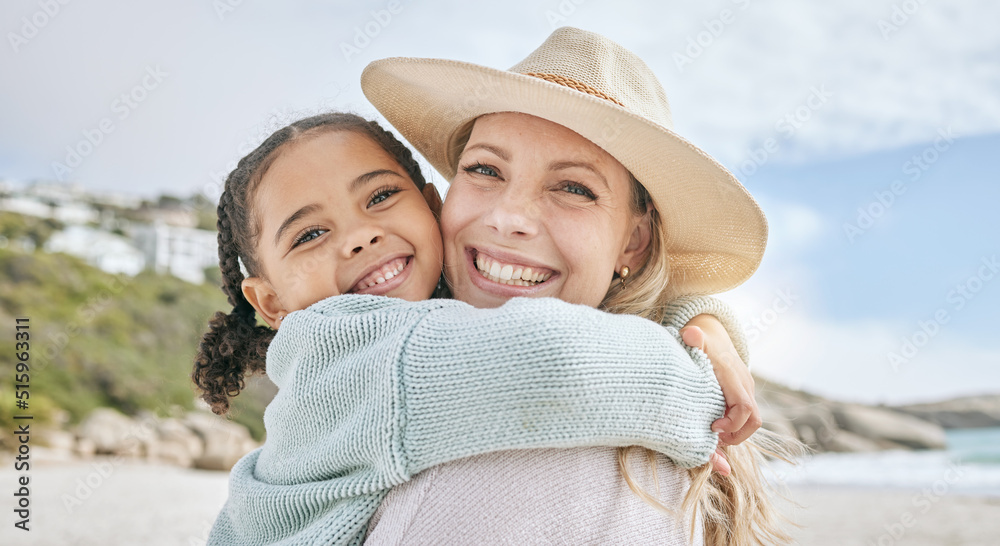 Portrait of a little girl bonding and hugging her mother at the beach. Carefree mom having fun with 