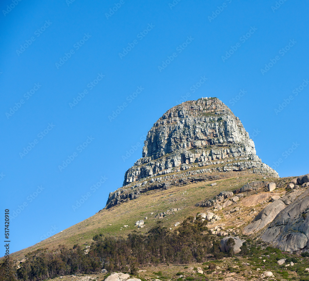Landscape of Lions Head mountain on a clear blue sky with copy space. Rocky mountain peak with rolli