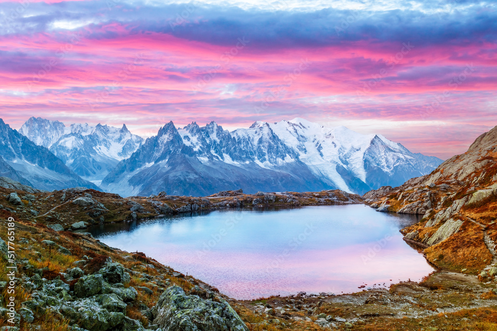Colourful sunset on Chesery lake (Lac De Cheserys) in France Alps. Monte Bianco mountain range on ba