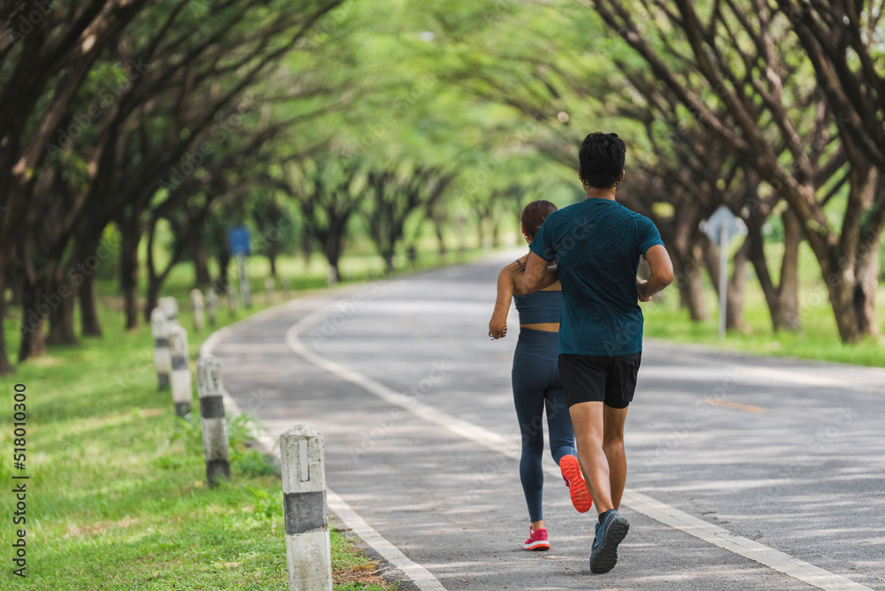 Asian couple, they are jogging and exercising.