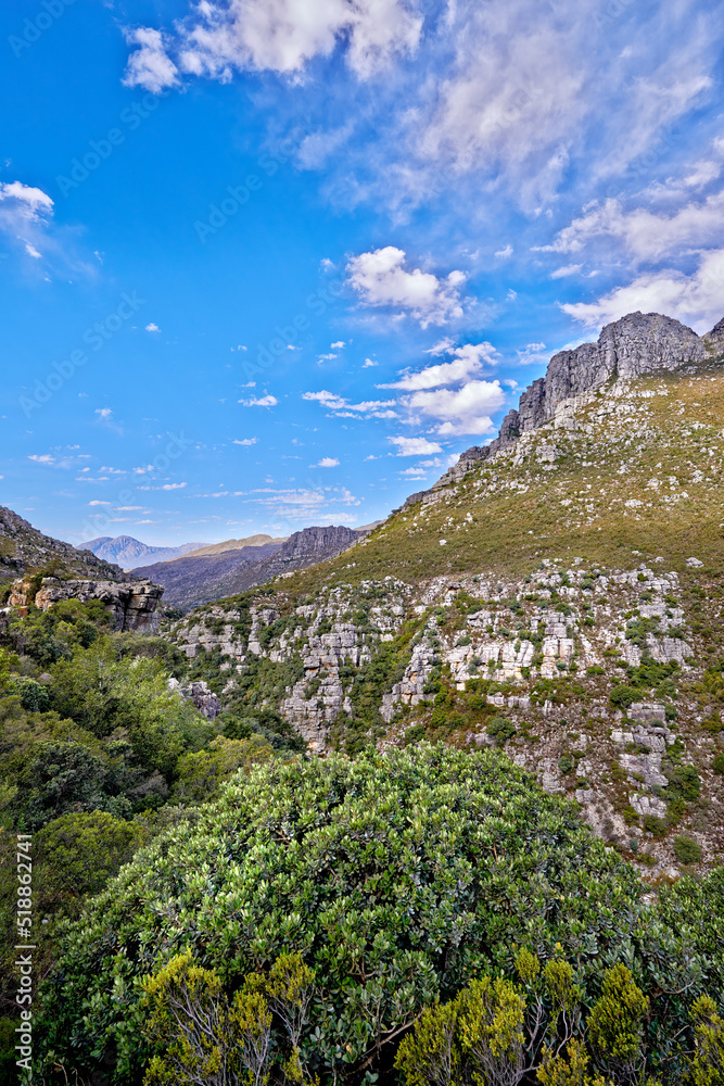 Copy space with mountain landscape against a cloudy blue sky background in Cape Town. Beautiful and 
