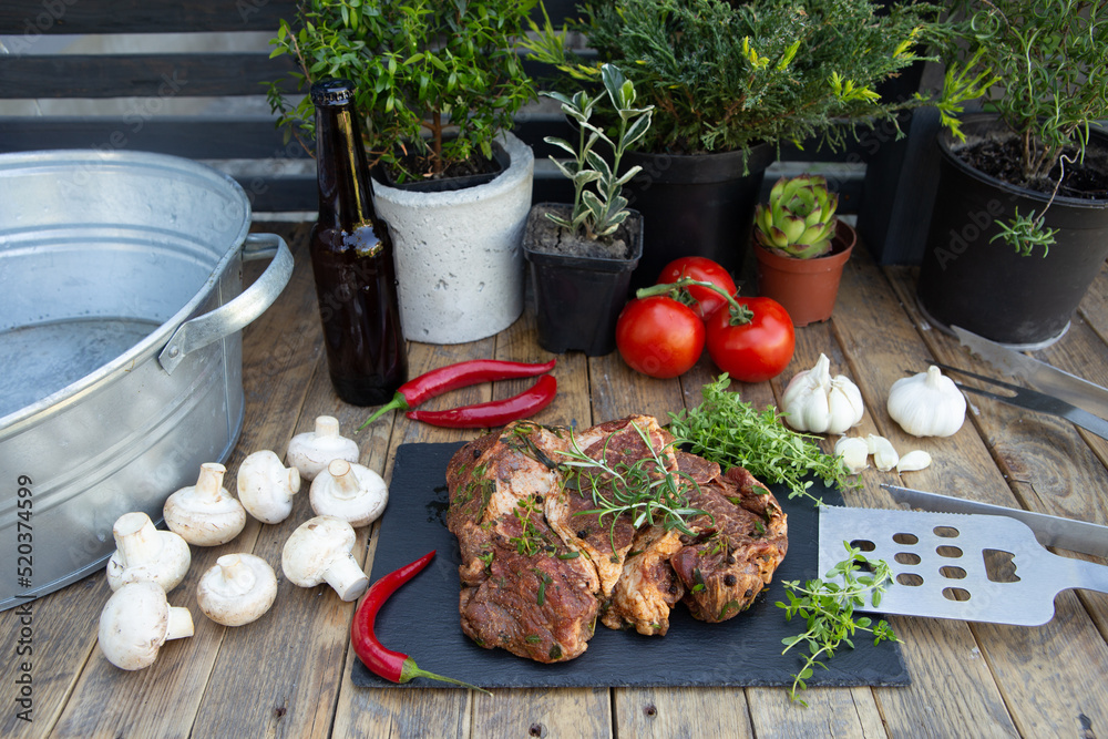 Marinated beef steak on wooden table top. Healthy food concept. Beef cut and spices for cooking bbq 