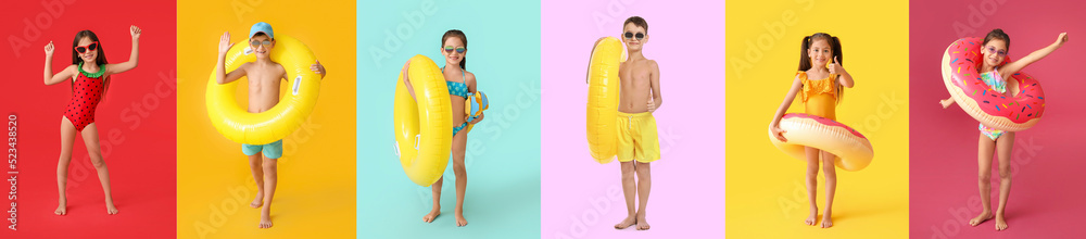 一群穿着泳衣的可爱小孩，带着充气环和彩色ba的浮潜桨