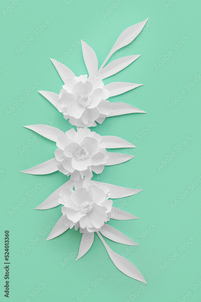 Composition with beautiful origami flowers and leaves on color background