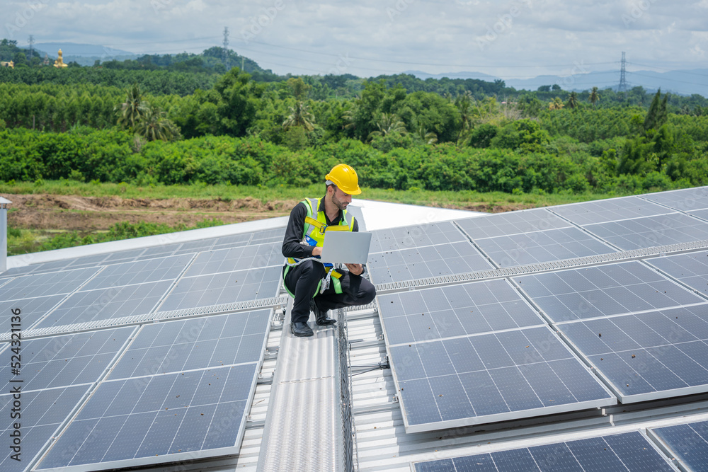Technician checking Solar panel on top roof,Sun energy,Solar panel, Alternative electricity source,C