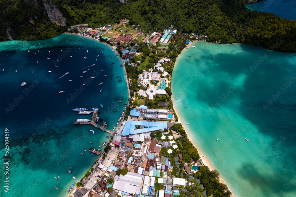 Aerial photo of Koh phi phi island in thailand with turquoise sea along with village and harbor
