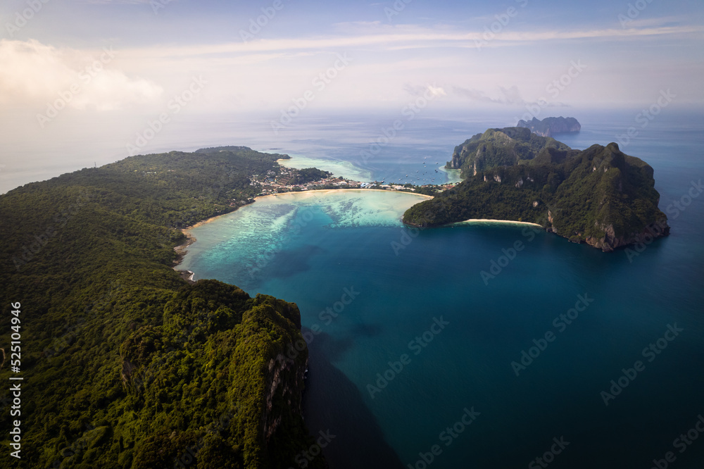 Aerial photo of Koh phi phi island in thailand with turquoise sea along with village and harbor