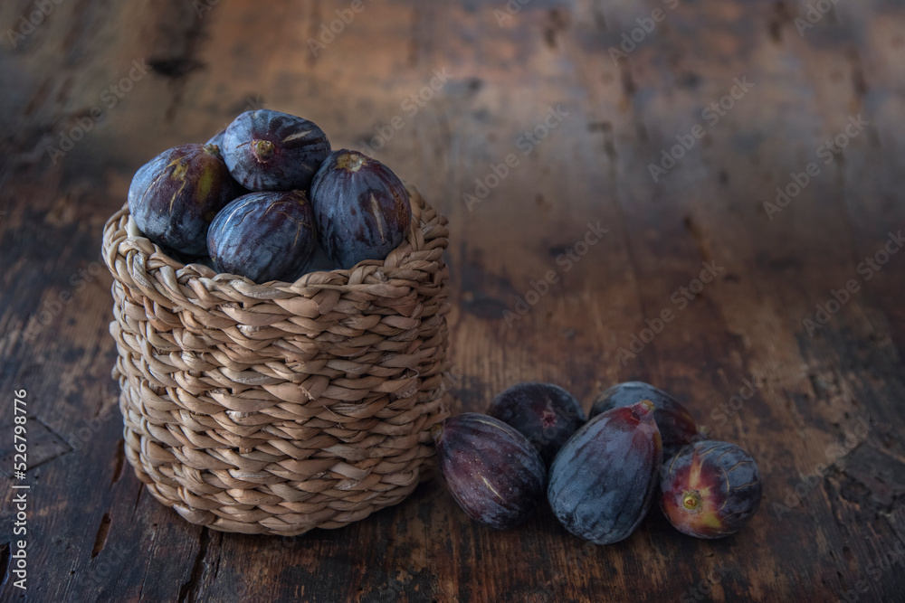 Basket with ripe black figs
