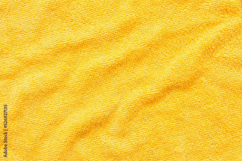 黄色超细纤维布表面，宏观纺织品图案背景