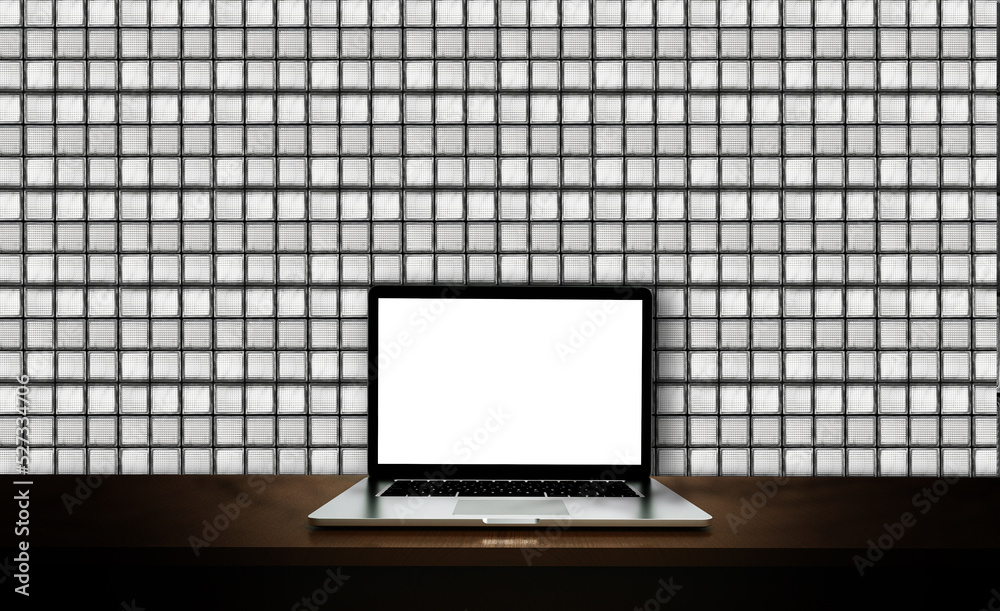 现代笔记本电脑隔离在砖玻璃墙背景上。3D插图。