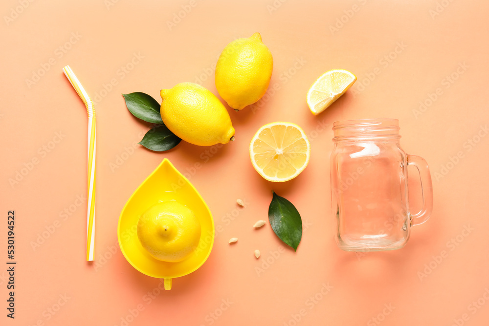 Composition with ripe lemons, straw, juicer and mason jar on color background