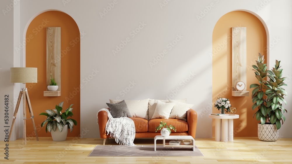 客厅有橙色皮沙发，双色调墙上的装饰很简约。