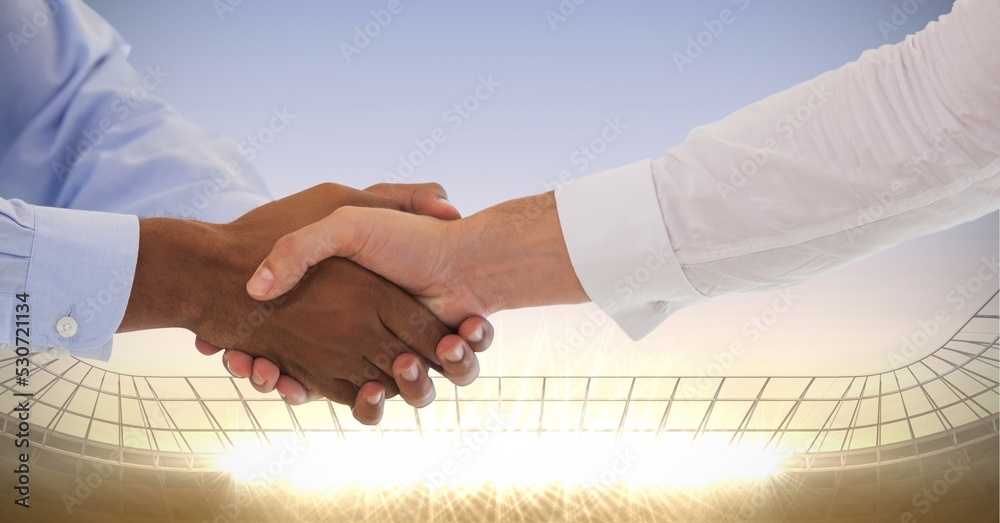 两名商人在体育场握手的构成