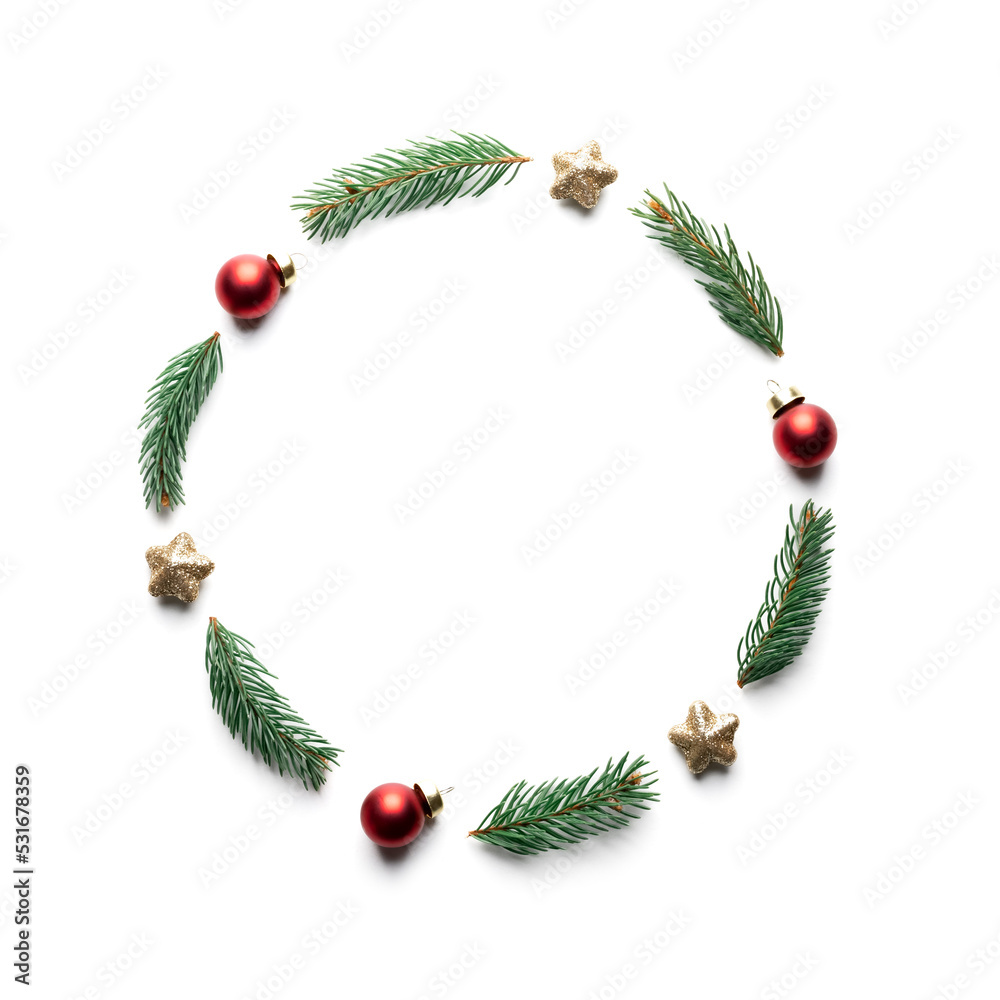 Creative Christmas background with Christmas balls, pine twigs and golden stars decorations on white
