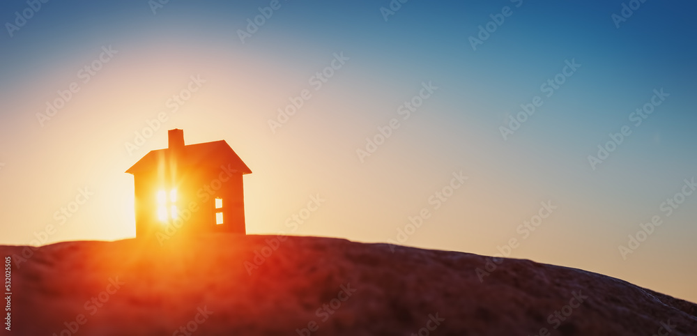 日落傍晚，一座房屋立在地上的模型。