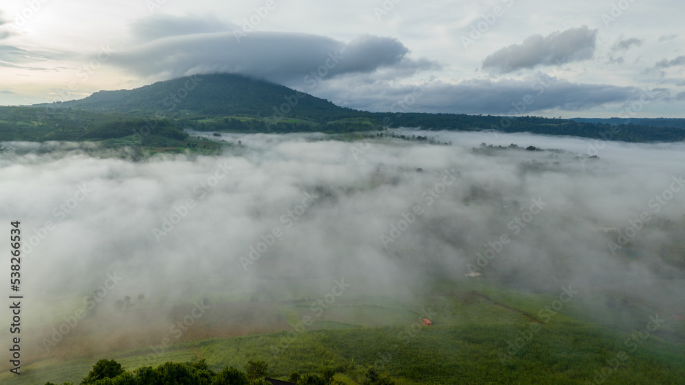 Mountains in fog at beautiful autumn in Phetchabun Thailand. Fog mountain valley, low clouds, forest