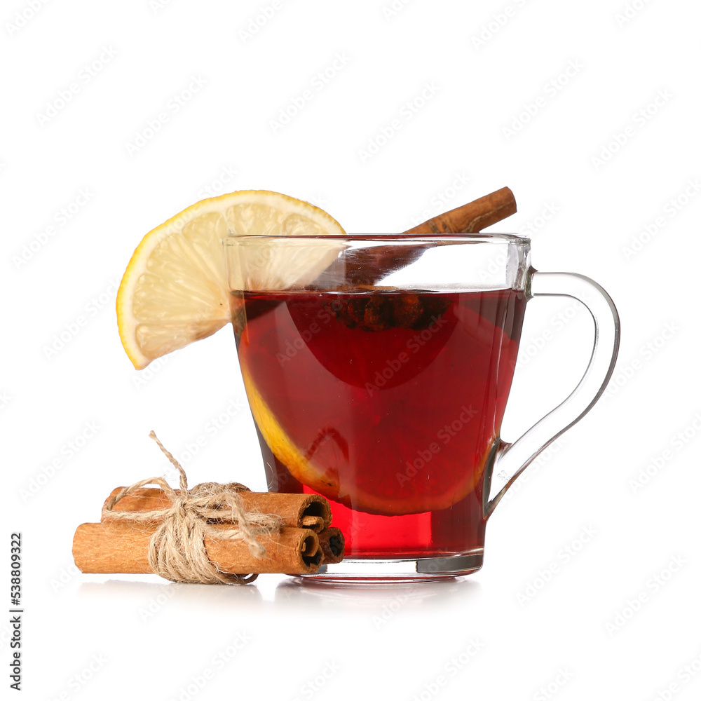 Cup of tasty mulled wine and cinnamon on white background