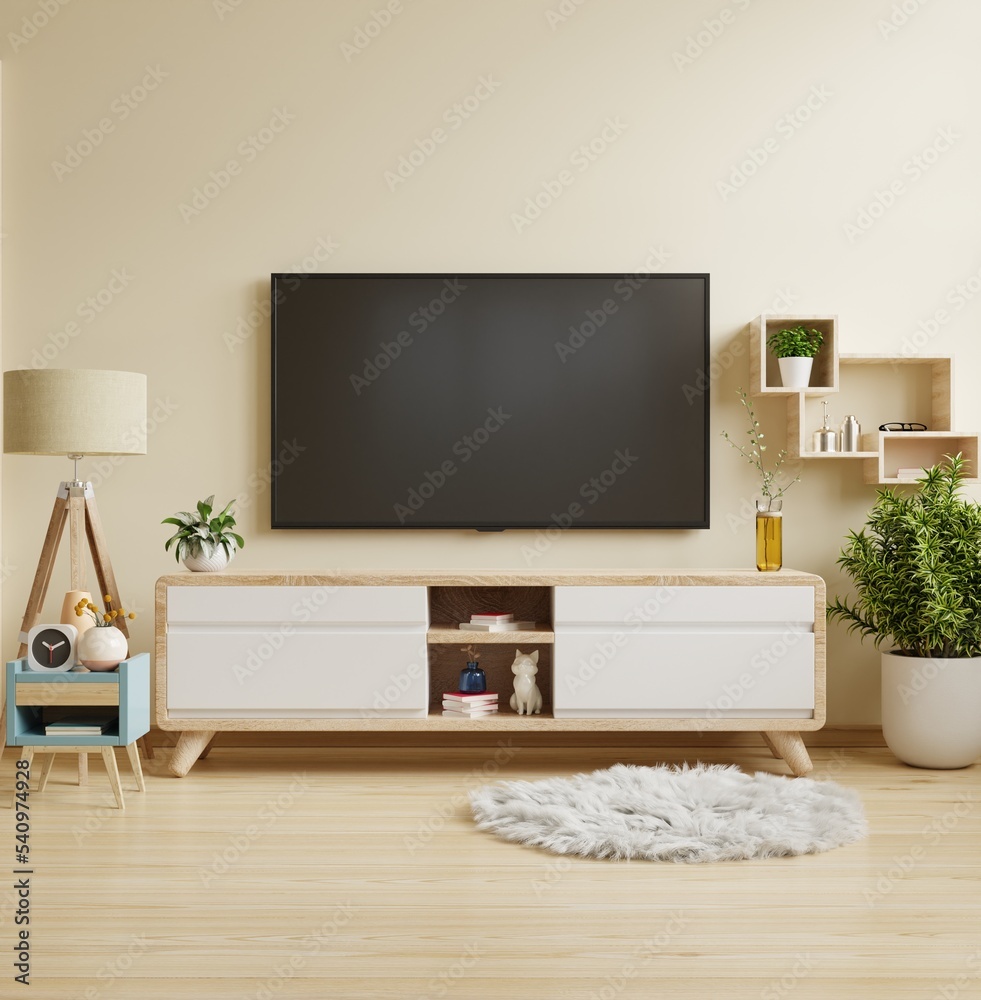 客厅橱柜上的米色壁挂电视，简约设计。