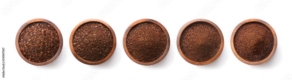 Flat lay of Different types of grinds coffee in wooden bowl isolated on white background. Clipping p