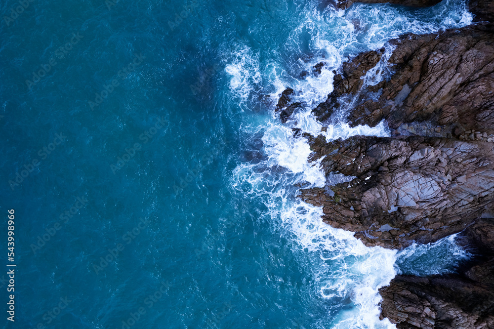 Aerial view of waves crashing on rocks,Seascape birds eye view photo shot over ocean waves, Image fo