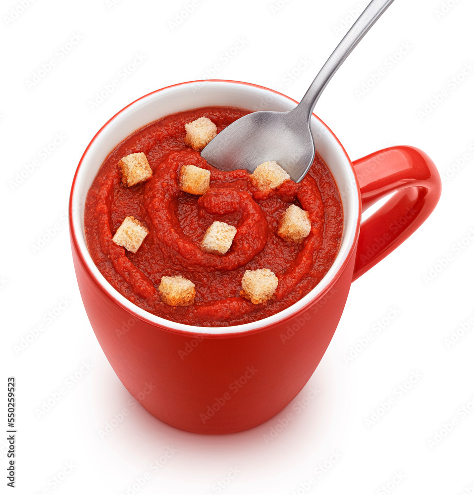 Instant tomato soup with croutons in red mug isolated, top view