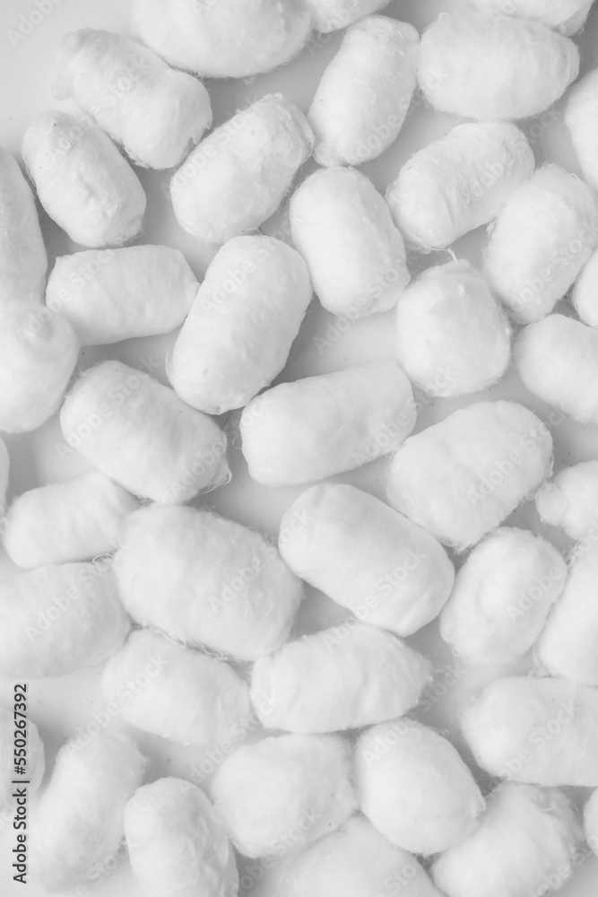 Soft cotton balls on light background, closeup