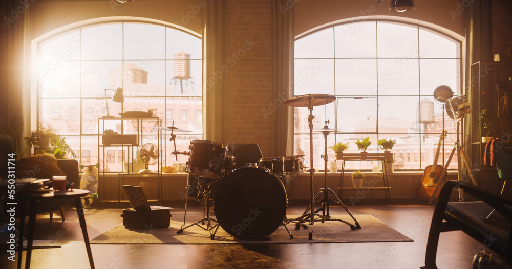 Establishing Shot: Music Rehearsal Studio in Loft Room with Drum Set in the Middle. Stylish Interior