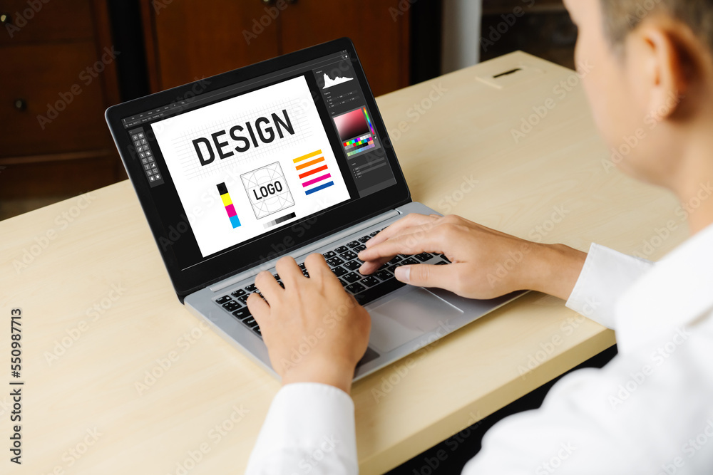 Graphic designer software for modern design of web page and commercial ads showing on the computer s