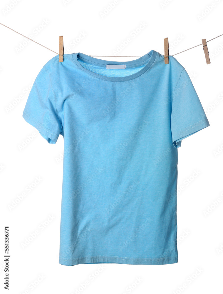 Blue t-shirt hanging on rope against white background
