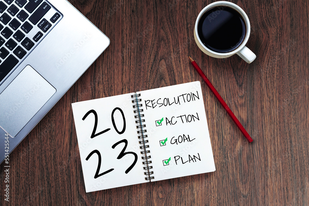 2023 Happy New Year Resolution Goal List and Plans Setting - Business office desk with notebook writ