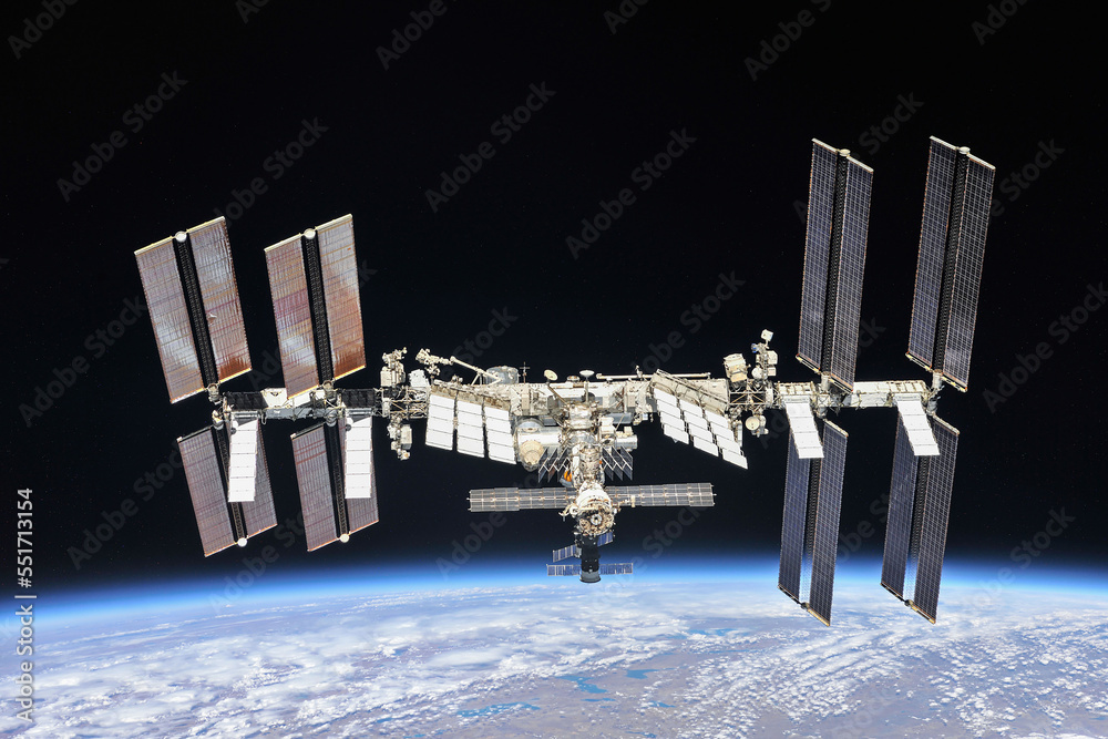 International space station orbiting the planet Earth. ISS. Dark background, soft stars. Digitally e