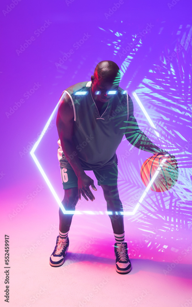 非洲裔美国秃头篮球运动员用发光的六边形和植物运球