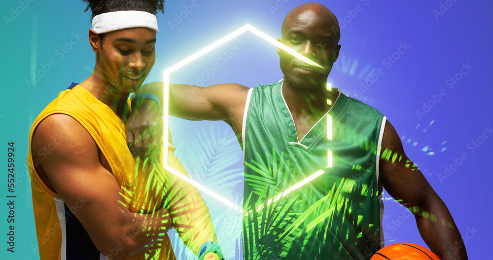 Composite of african american basketball players standing by illuminated plants and hexagon