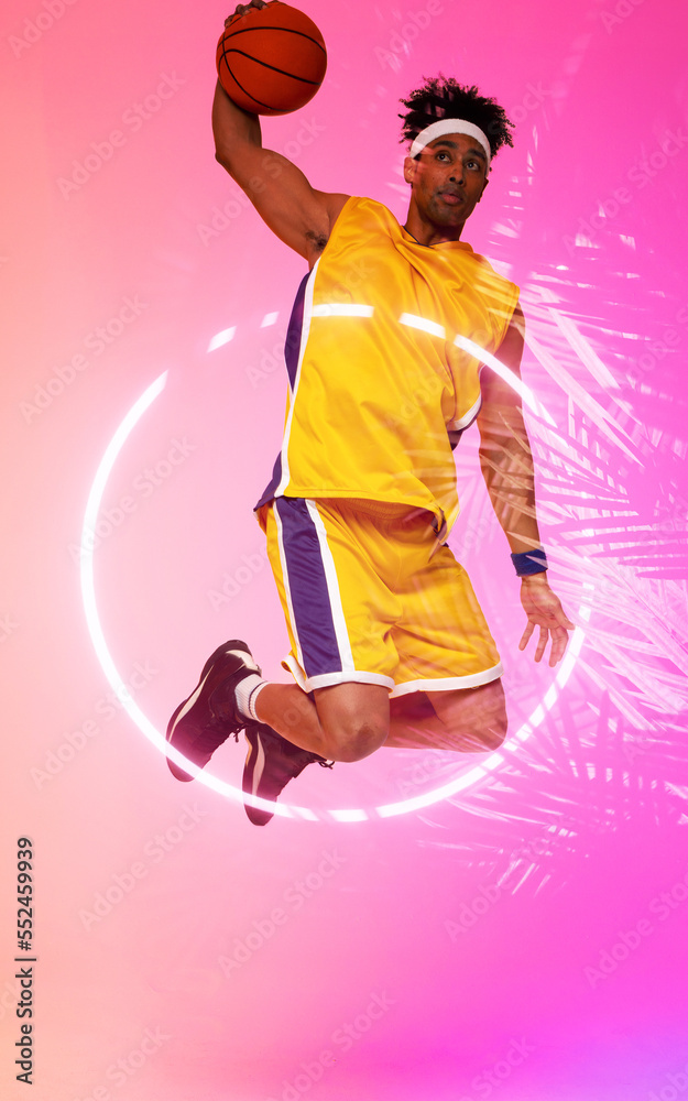 Composite of biracial player jumping and taking a shot with basketball by circle and plants