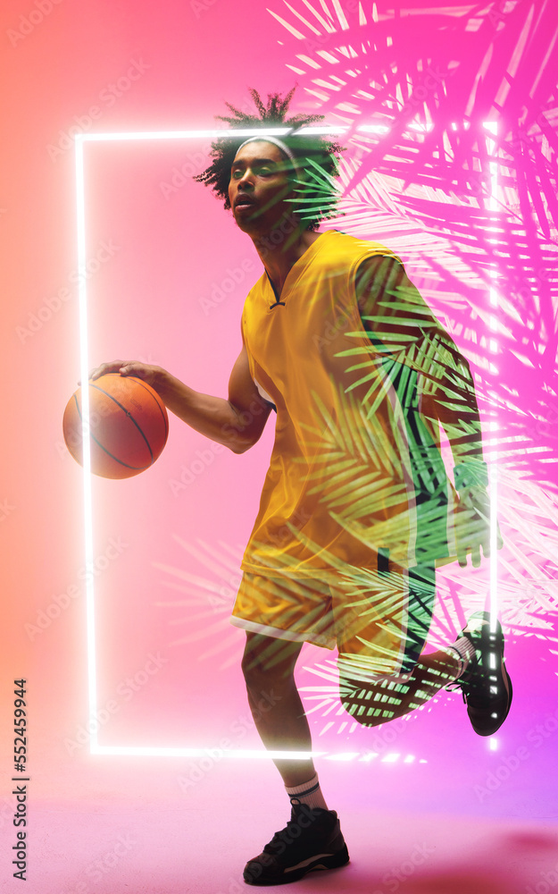 Full length of biracial basketball player dribbling ball by illuminated plants and rectangle