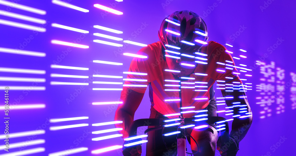 Illuminated lines over african american male athlete riding bike over blue background