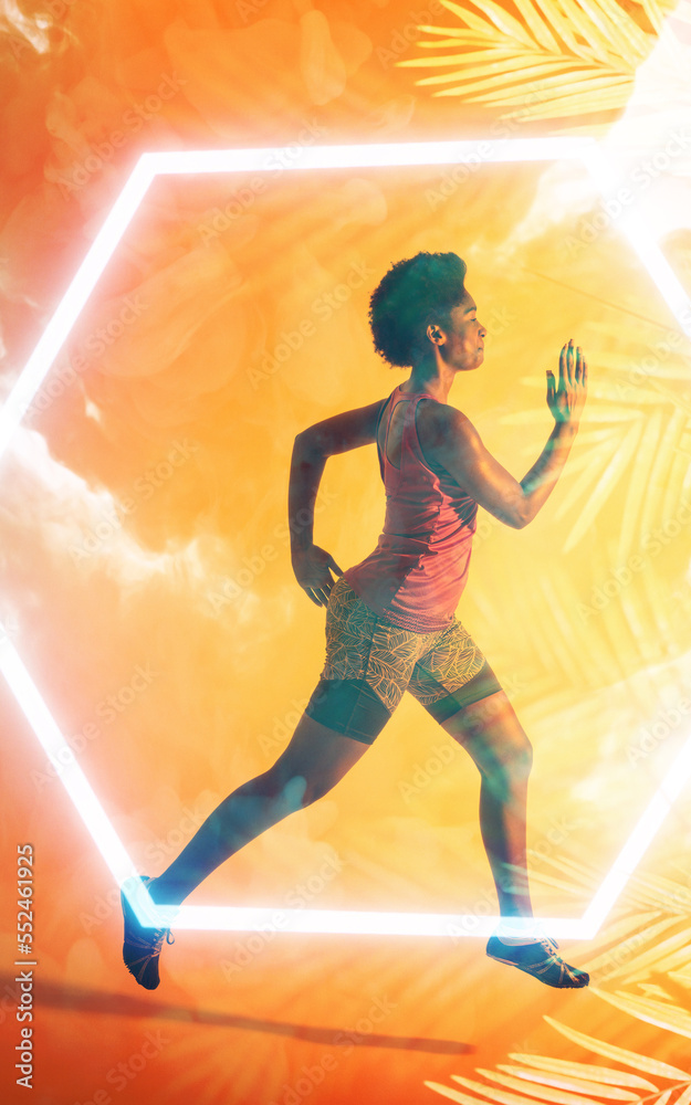 Composite image of determined african american female athlete running over leaf pattern