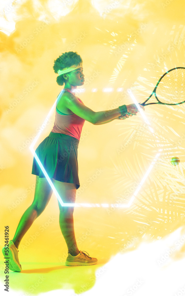 Composite of dedicated young african american female tennis player playing over leaf pattern