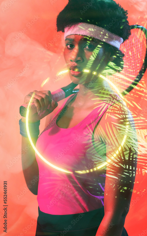 Portrait of young african american female tennis player with neon and leaf pattern