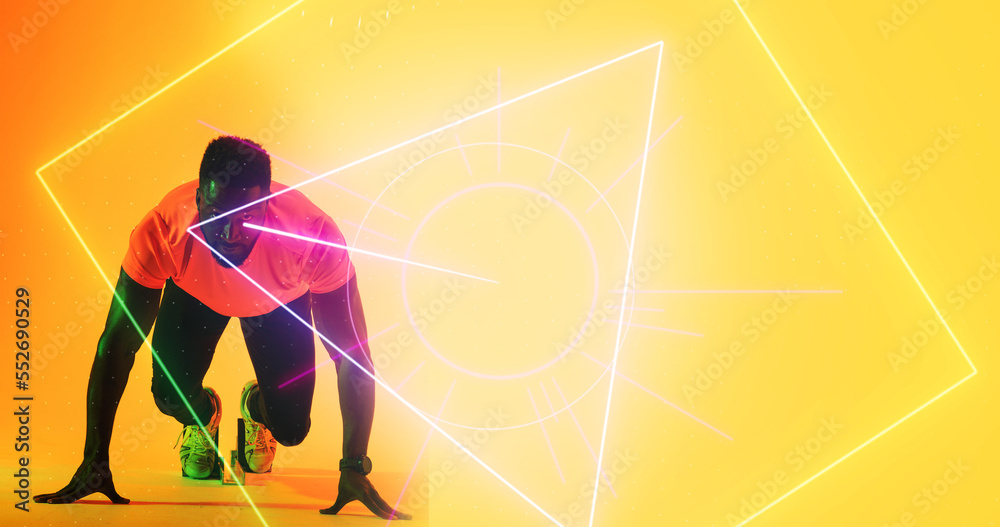 African american male athlete at starting position over geometric shapes on yellow background