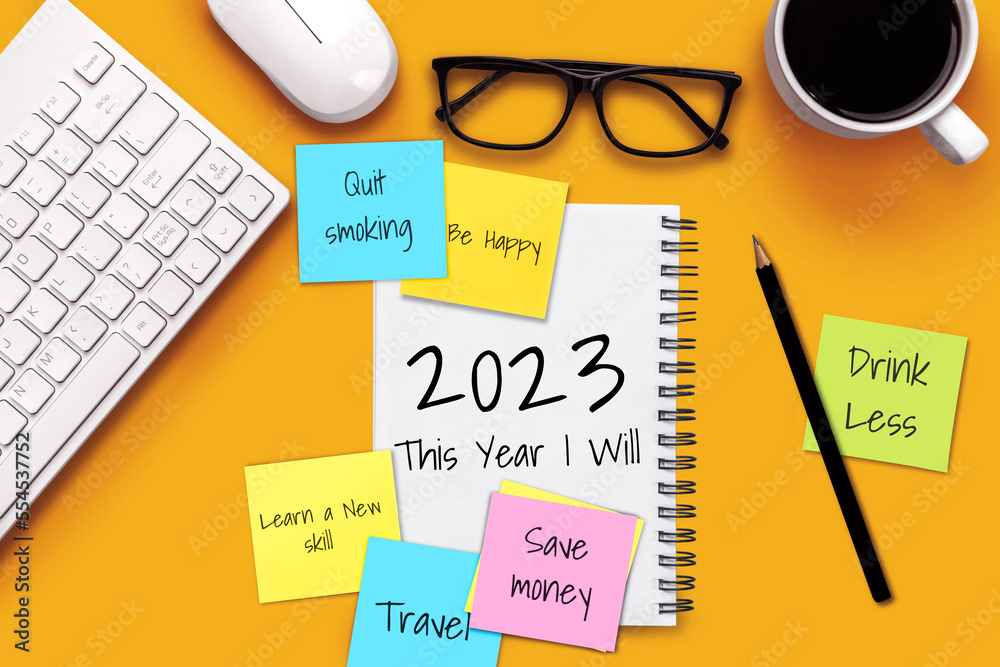 2023 Happy New Year Resolution Goal List and Plans Setting - Business office desk with notebook writ