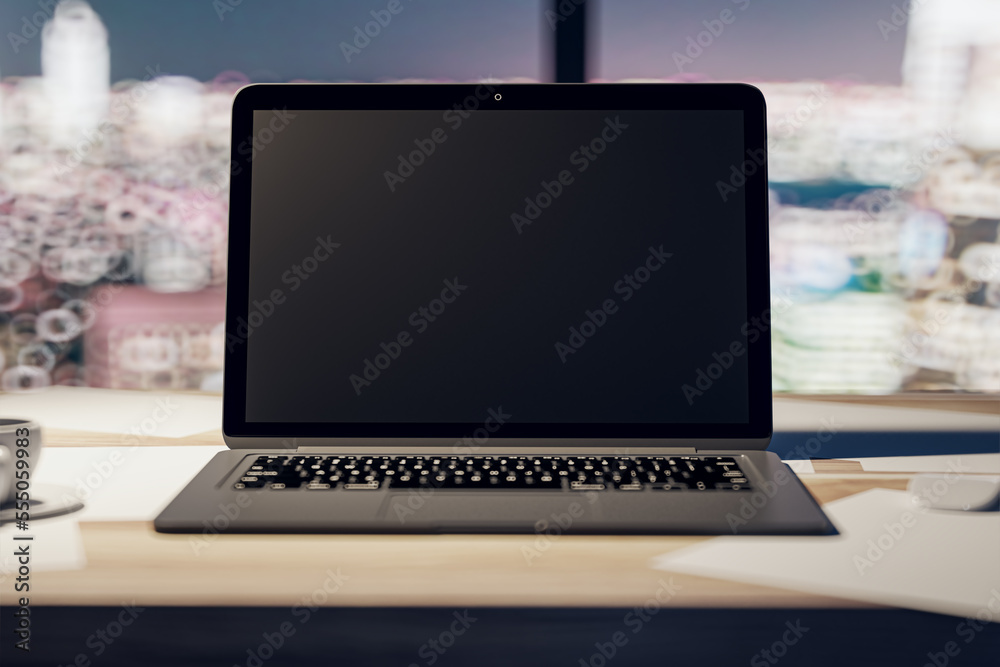 Front view on blank black modern laptop screen with place for your logo or text on light wooden surf